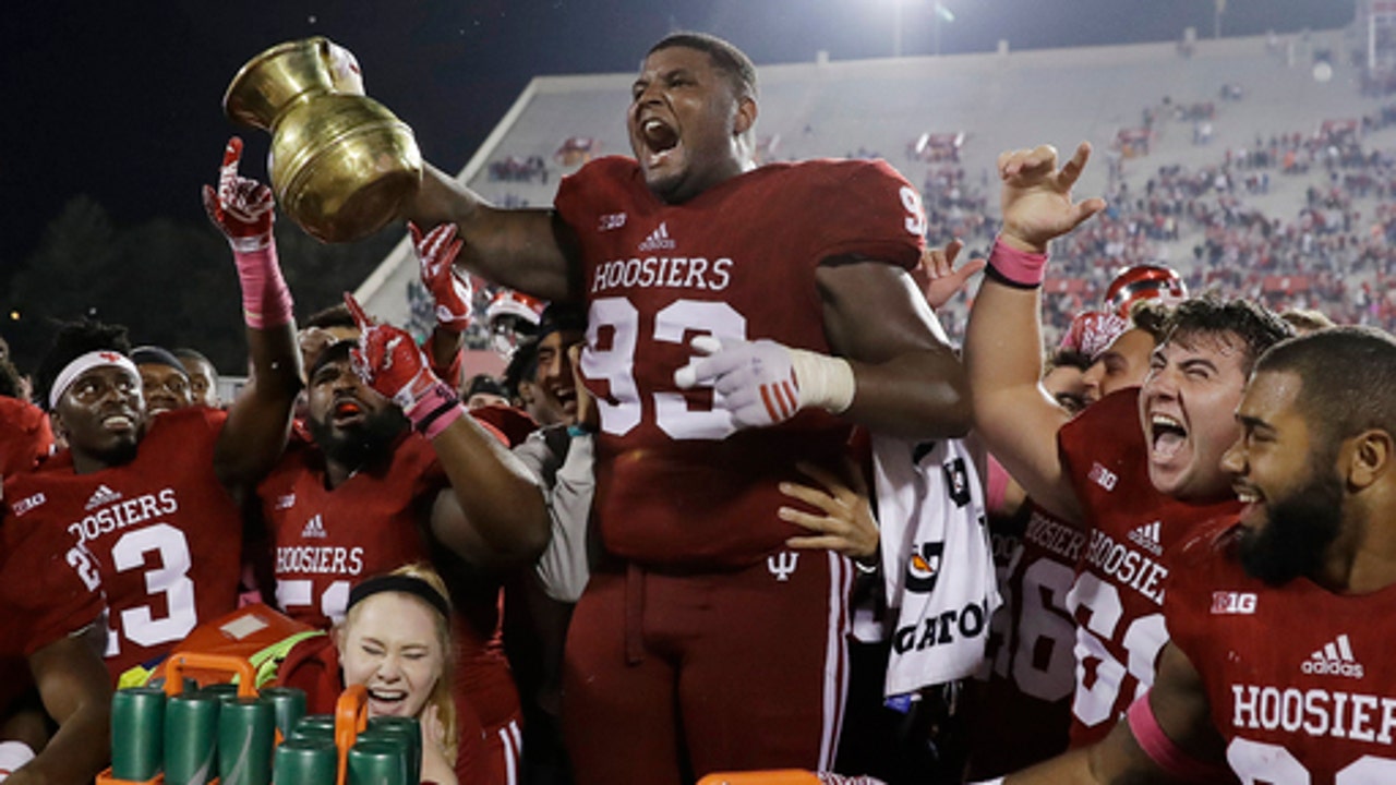 Indiana uses late rally to upset No. 17 Spartans 24-21 in OT